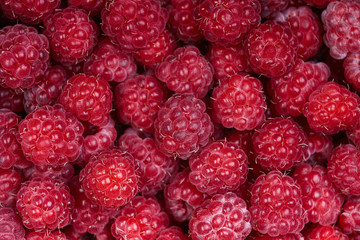 Background of a beautiful fresh raspberry. Healthy food. Vegetarianism.