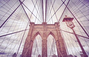 Looking up at the Brooklyn Bridge, color toned picture, New York City, USA.