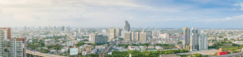 Aerial view of city, Landscape of Bangkok city skyline in Aerial view with skyscraper, modern office building and blue sky with cloudy sky background in Bangna Bangkok, Thailand.