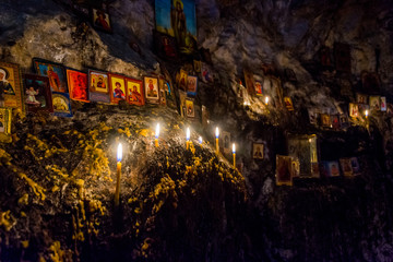 Candles and relics in the cave