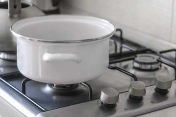pot stands on a gas stove