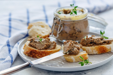 Baguette slices with homemade beef liver pate.