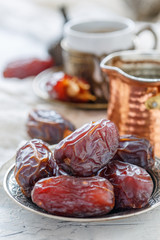 Delicious dates on a bronze plate.