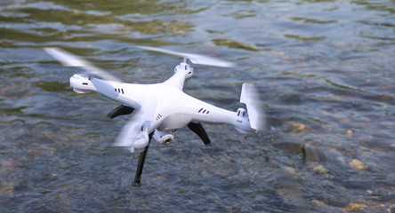 drone fell into the water on the river among the stones stuck, breakdown is required repair rescue accident
