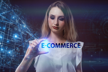 The concept of business, technology, the Internet and the network. A young entrepreneur working on a virtual screen of the future and sees the inscription: E-commerce