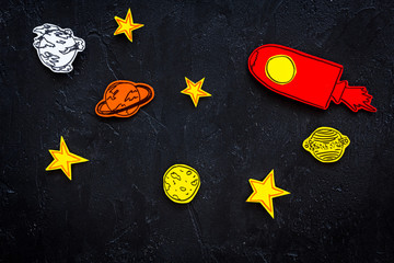 Space research concept. Drawn stars and rocket or space shuttle on black outer space background top...