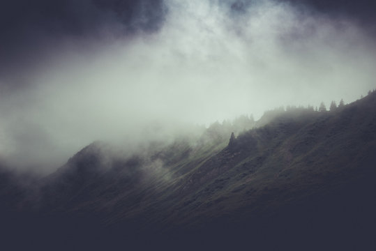 Moody stormy mountain landscape with cloud