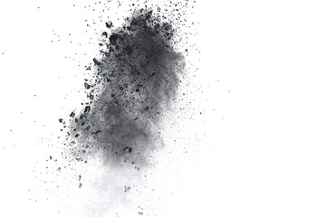 Fototapeta na wymiar Black powder explosion against white background.Closeup of black dust particles explode isolated on white background.
