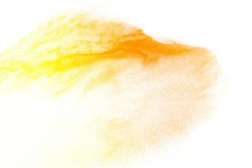 Yellow color powder explosion cloud isolated on white background.