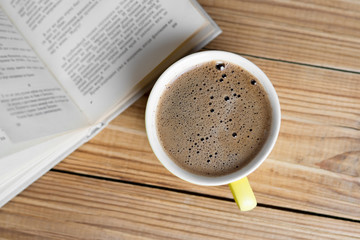 Coffee mug and book top view