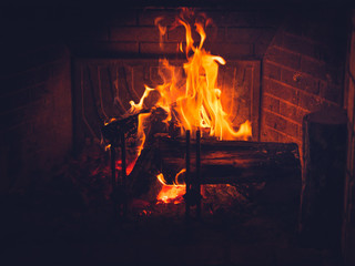 Burning wood in fireplace in a countryside house