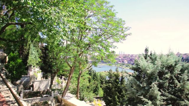 Cemetery Sultan Eyup, The Halich Bridge and panoramic view of the Golden Horn Bay in Istanbul, Turkey.