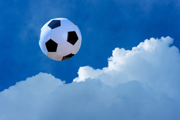 Soccer ball on a beautiful sky background with clouds