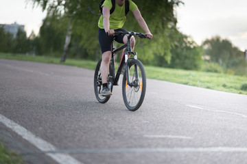 Velo racer on the asphalt road in the evening sun