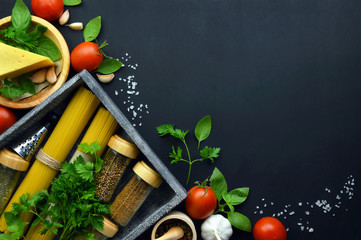 Food frame italian food background . healthy food concept or ingredients for cooking pesto sauce on dark background . top view with copy space.