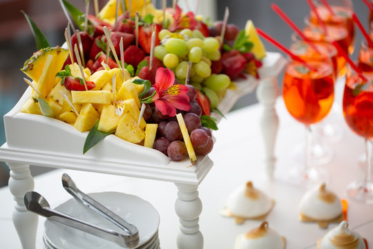 Image of strawberry cocktails, fruit and biscuits closeup