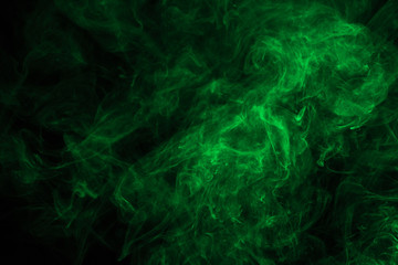abstract background with green mystical smoke on black