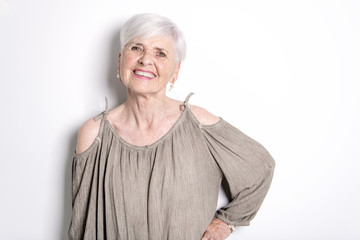 elderly woman on studio white background
