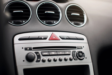 Car air conditioning. The air flow inside the car. Detail audio system buttons in car.