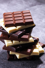 chocolate in diffrent color. milk, dark and white chocolate bars