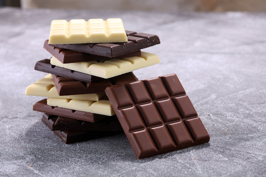 chocolate in diffrent color. milk, dark and white chocolate bars