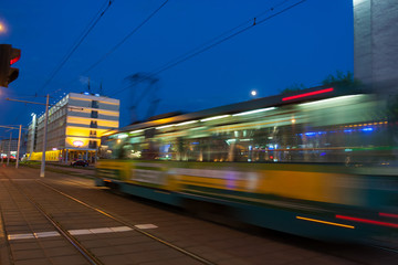 Fototapeta na wymiar The motion of a blurred tram at dusk.