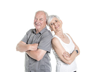 Senior couple posing on studio white background arm cross