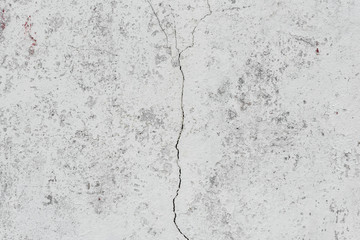 Fototapeta premium Wall fragment with scratches and cracks
