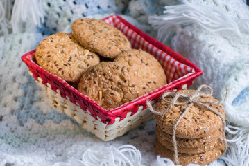 Savory cookies sprinkled with sesame seeds, sunflower on textile plaid