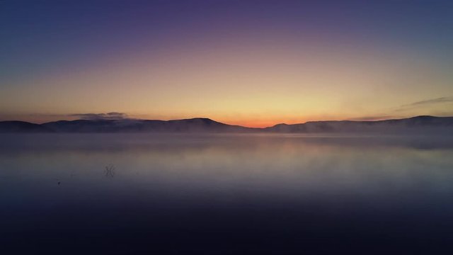 Morning fog on the lake, sunrise shot