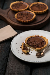 chocolate tart, tartlets, vintage, white plate, wooden, wood board, old table, dessert, rustic style, close up