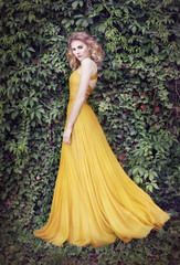 Beautiful girl in long dress, in nature