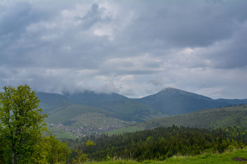 Fototapeta premium Mountain landscape, in the background - Ukrainian mountain Chornogor in the clouds.