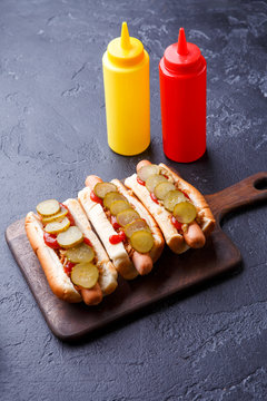 Photo on top of hotdogs on cutting board