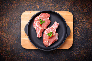 Raw meat  in cast iron pan
