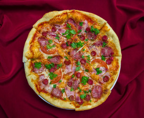 great pizza with sausage tomatoes and greens