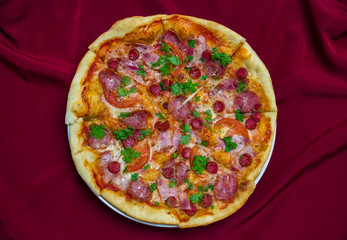 great pizza with sausage tomatoes and greens