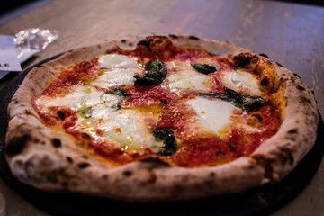 Delicious pizza with basil and mozzerella