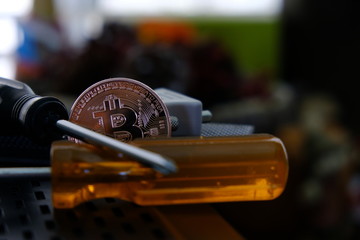 Screw drivers in front of Bitcoin