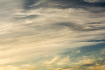 layered clouds at sunset time, dark blue sky, nature abstract background