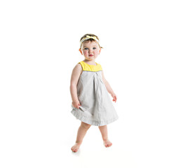 Portrait of a young girl with yellow clothes on photo studio