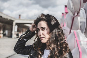 Girl in white shirt and fur jacket