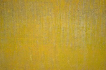 Yellow wall with irregularities in the finish. Background structure.