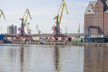 port cranes are on the shore