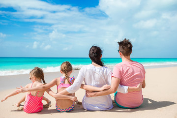 Happy family with kids on the beach