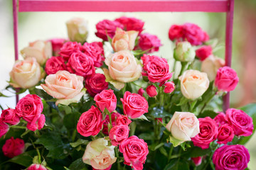 Decorated flowers roses bunch in basket.