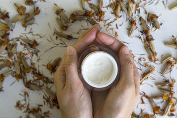 hand care with cream and flowers.