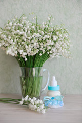 decorative baby bottle with milk are on the table. For a baby shower celebrate. for thematic birthday decor