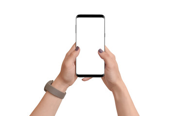 Obraz na płótnie Canvas Hands holding modern phone in vertical position with isolated screen on white background. Mockup