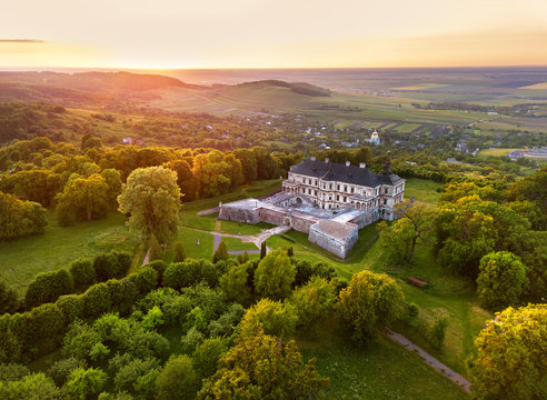 Aerial view of aincient Castle. Sunset over summer park